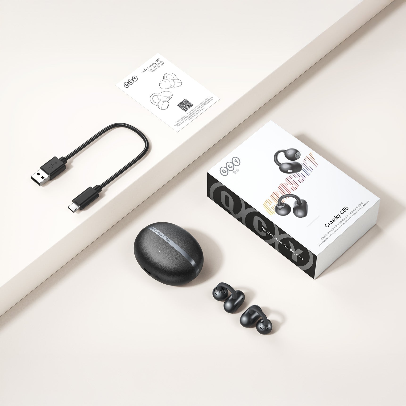 Écouteurs True Wireless QCY Crossky C50 avec boîtier de chargement, USB-C et manuel.