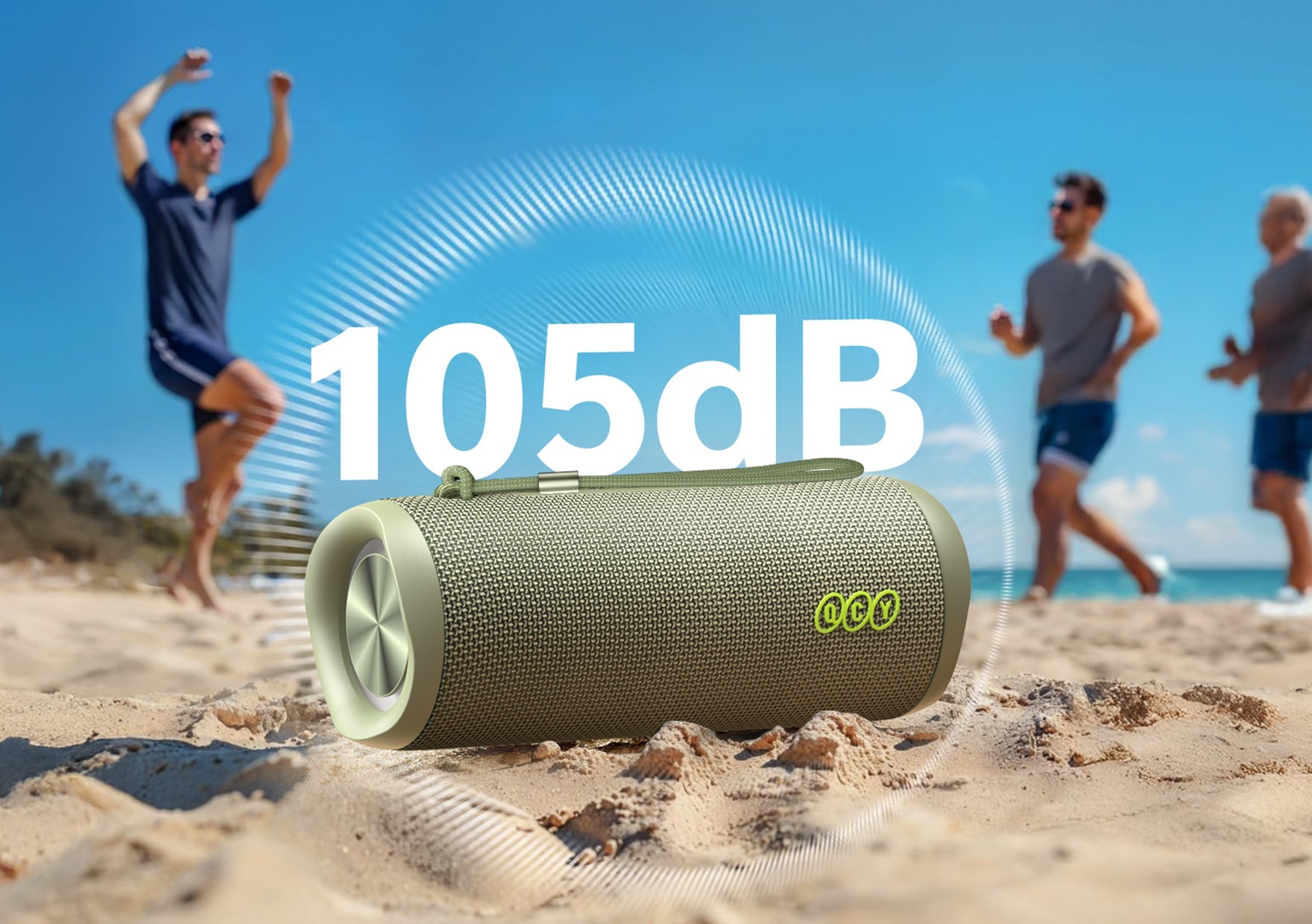 Haut-parleur Bluetooth Ocy 105 dB dans le sable, fête sur la plage avec des amis, design robuste pour une utilisation en extérieur