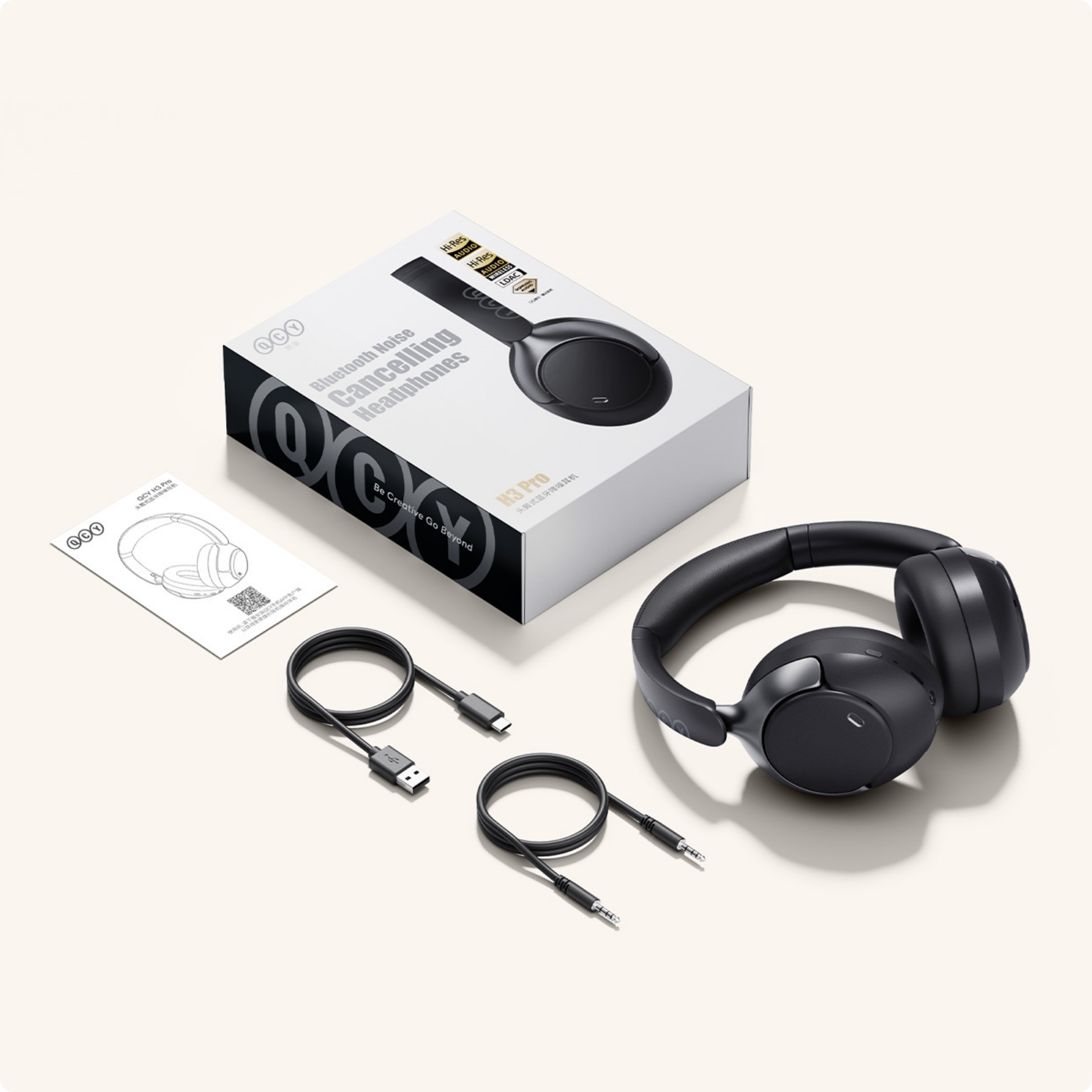 Casque Bluetooth QCY H3 Pro avec réduction de bruit, câbles et emballage.