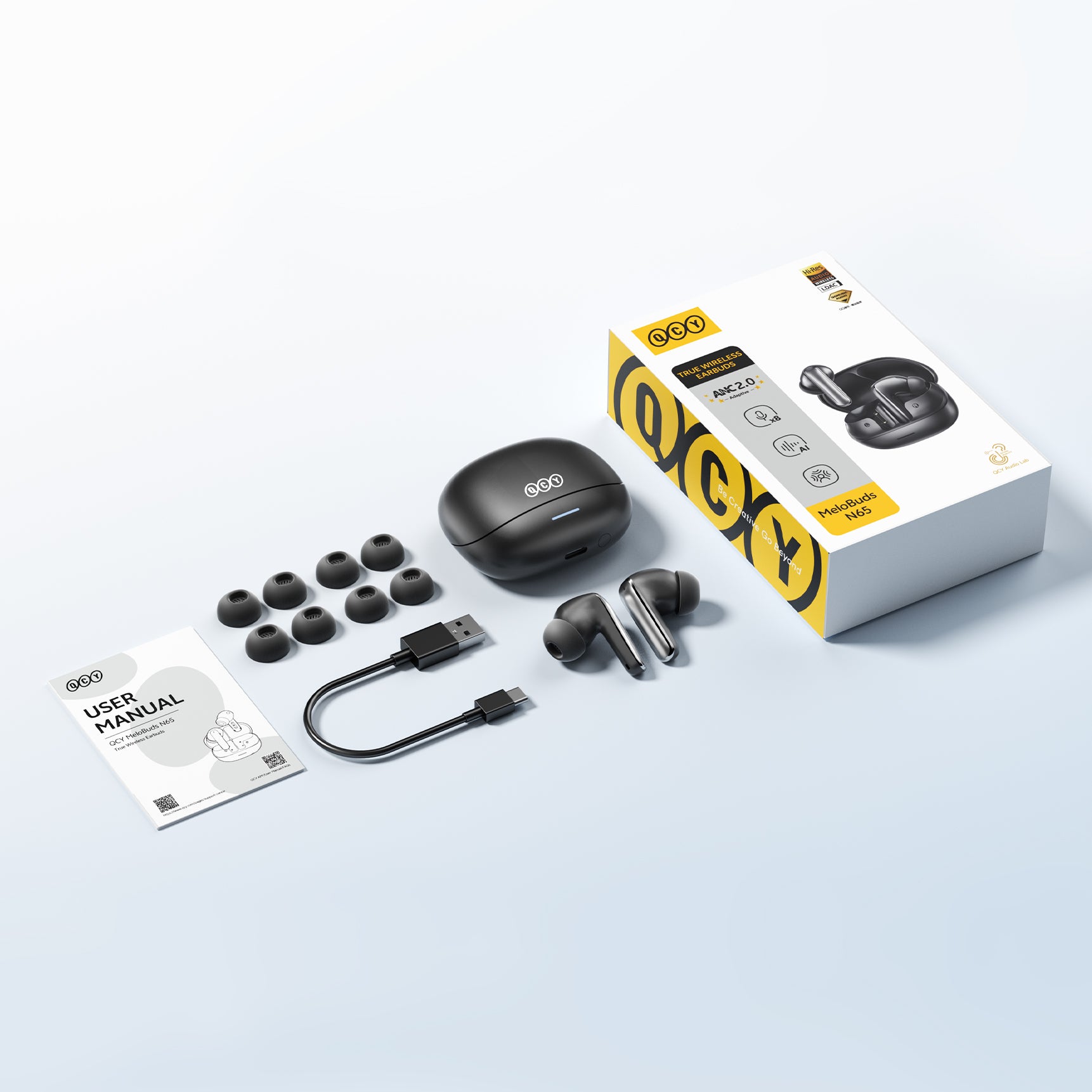 Écouteurs True Wireless QCY MeloBuds N65 avec ANC, câble de charge USB-C et embouts de rechange.